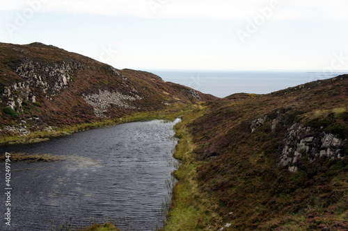 Tiny lake Slievenalogh on top of the mountain of the same name.Cooley Peninsula.Ireland.