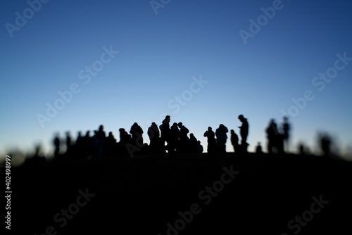 Tokyo,Japan-January 1, 2021: Silhouette of people on a hilltop   © Khun Ta