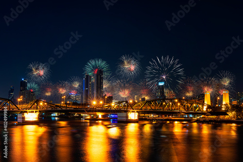 Firework New year Celebration at the Phra Phuttha Yodfa Bridge, Memorial Bridge. Bangkok Thailand -January 1,2021.