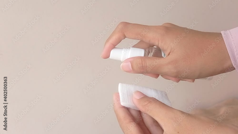 spraying a toner into a cotton spraying a toner into a cotton