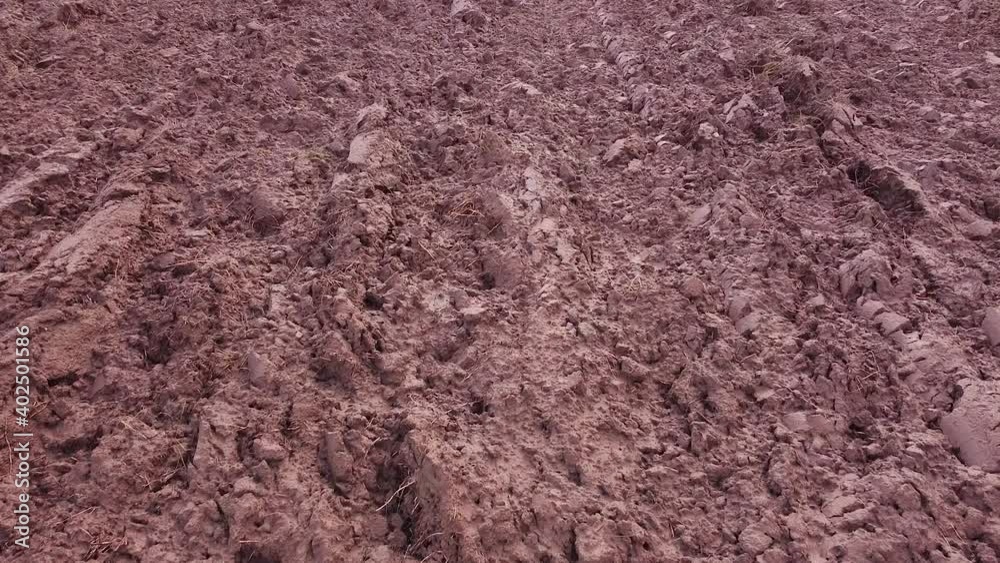 Freshly plowed soil field for cereals from above aerial view Freshly plowed soil field for cereals from above aerial view