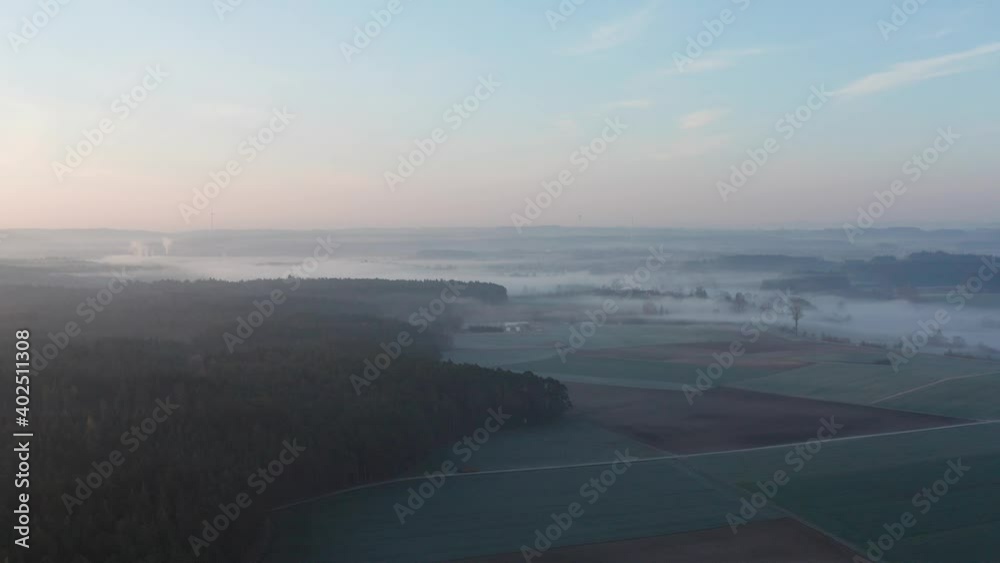 Drone flight in the morning over a forest and fog. Drone flight in the morning over a forest and fog.