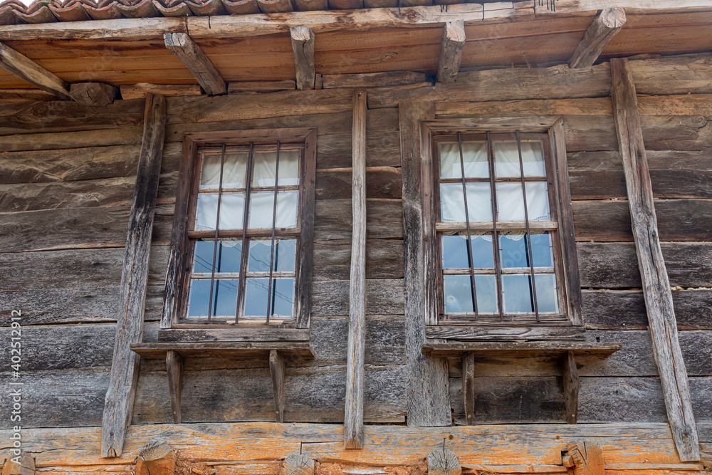 Detail from old wooden and stone house in a village Detail from old wooden and stone house in a village