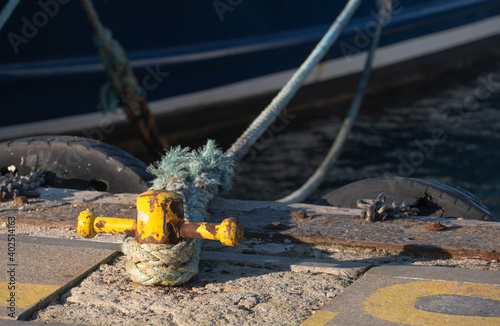 bollard and rope on the pier, makefast, photo