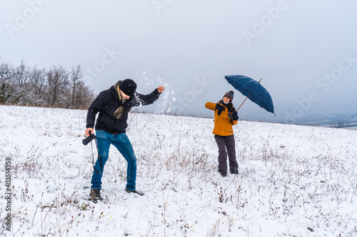 Friends playing with snowballs in the snow Snow in the town of Opakua near Vitoria in Araba, Basque Country. Spain photo