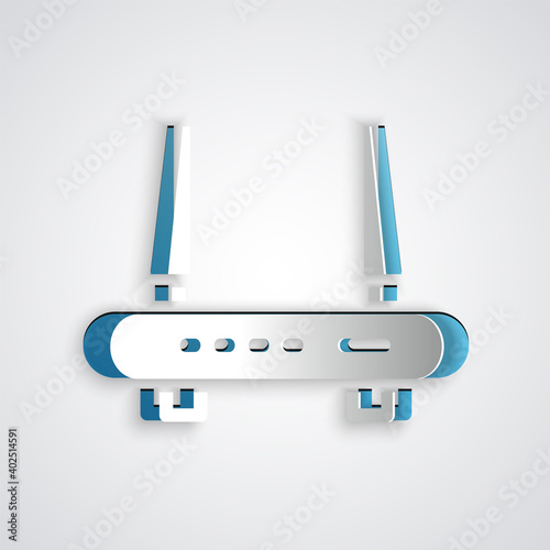 Paper cut Router and wi-fi signal icon isolated on grey background. Wireless ethernet modem router. Computer technology internet. Paper art style. Vector.