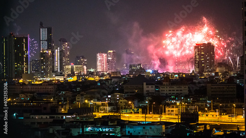 The high angle background of the city view with the secret light of the evening, blurring of night lights, showing the distribution of condominiums, dense homes in the capital community