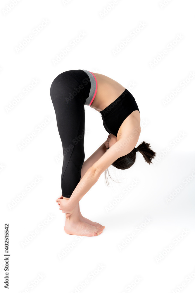 Young woman doing yoga practice isolated on white background. Flexible fit female body. Vertical shot. High resolution sharp photo. Young woman doing yoga practice isolated on white background. Flexible fit female body. Vertical shot. High resolution sharp photo.
