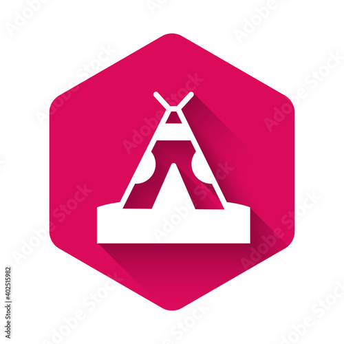 White Traditional indian teepee or wigwam icon isolated with long shadow. Indian tent. Pink hexagon button. Vector.