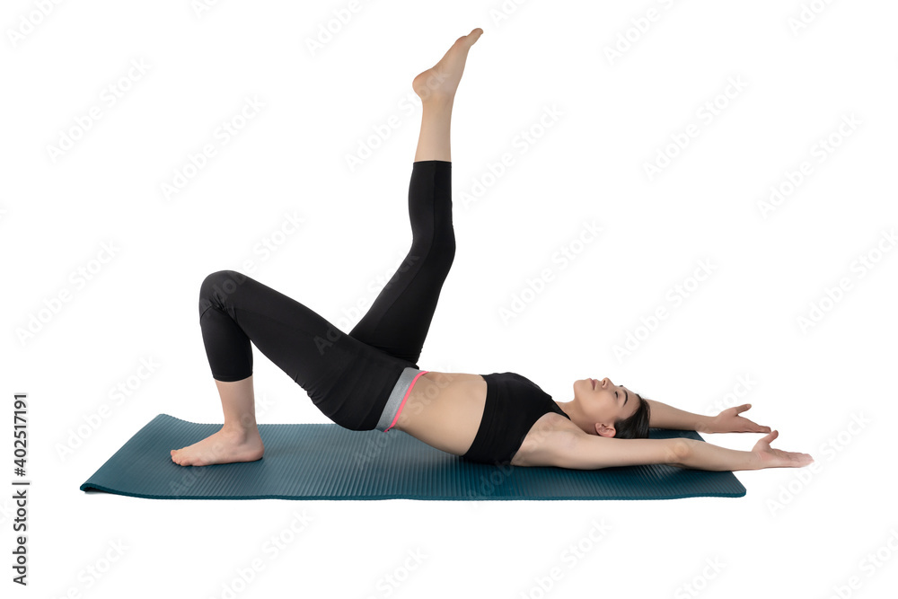 Young woman doing yoga practice isolated on white background. Flexible fit female body. Horizontal shot. High resolution sharp photo. Young woman doing yoga practice isolated on white background. Flexible fit female body. Horizontal shot. High resolution sharp photo.