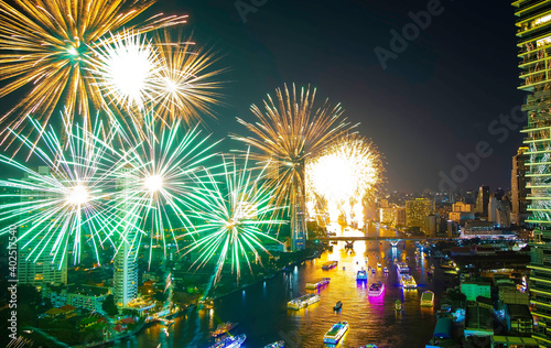 Happy celebration of new year with Fireworks light up the sky with dazzling display.