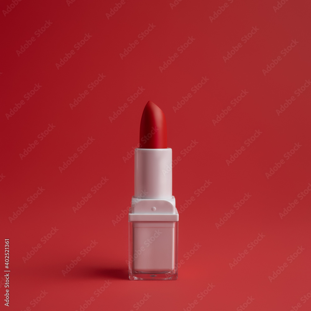 Beautiful lipstick on isolated on red background. Minimal make up or beauty salon concept. Beautiful lipstick on isolated on red background. Minimal make up or beauty salon concept.