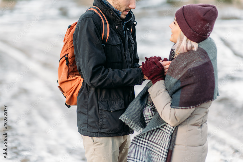 Young couple in love holding hands outdoor. Two lovers in Saint Valentine Day Young couple in love holding hands outdoor. Two lovers in Saint Valentine Day