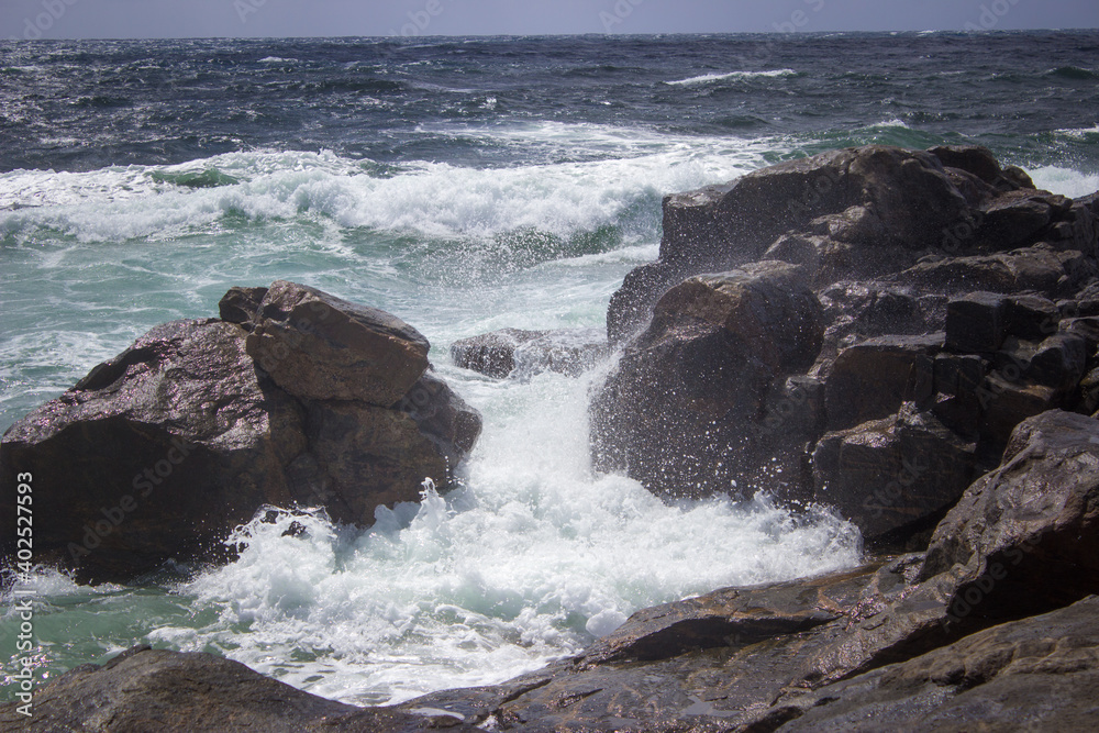 waves crashing on rocks