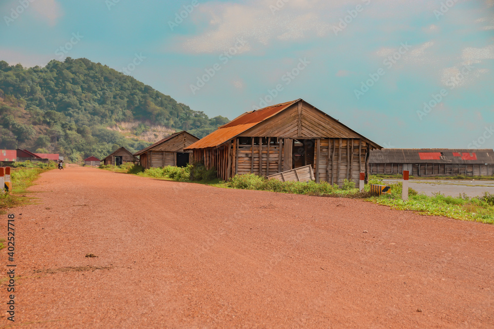Scenic view of a wooden salt storage house in famous salt farms of Kampot, Cambodia Scenic view of a wooden salt storage house in famous salt farms of Kampot, Cambodia