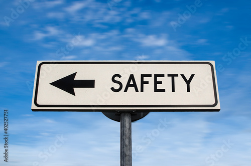 Safety road sign, arrow on blue sky background. One way blank road sign with copy space. Arrow on a pole pointing in one direction.