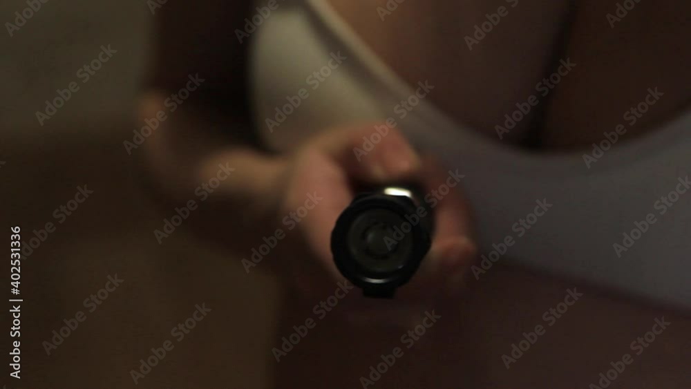 Girl in hands with a flashlight, close-up. Girl in hands with a flashlight, close-up.