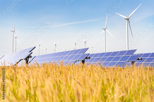 Solar plant with the wind farm in the summer season, hot climate causes increased power production and If strong winds will add the power generated, Alternative energy to conserve the world's energy photo