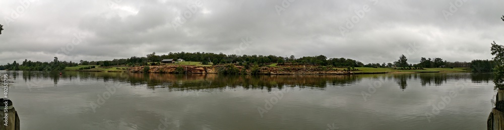 Beautiful panoramic view of river with reflections of small hills, trees and clouds on water, Hawkesbury river, Cattai national Park, New South Wales, Australia
Beautiful panoramic view of river with reflections of small hills, trees and clouds on water, Hawkesbury river, Cattai national Park, New South Wales, Australia