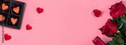 Valentine's Day dating gift with wine and rose concept on pink background