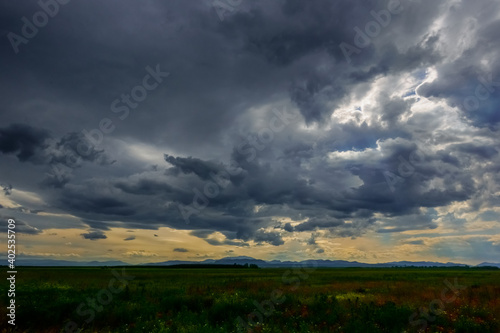 dark rain clouds before rain in a flat landscape