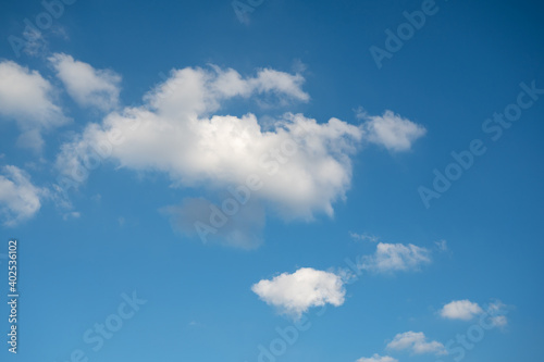 Blue sky with white clouds in daylight for background.