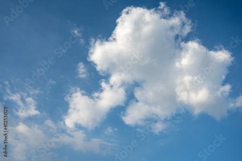 Blue sky with white clouds in daylight for background.