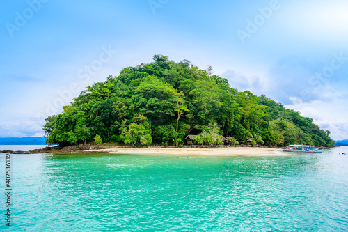 Cayoya Island (also known as Exotic Island) in Port Barton Bay with paradise white sand beaches - Tropical travel destination in Palawan, Philippines