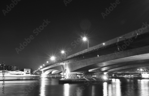 landscape of Phra Pok Klao memorial bridge cross  river in Thailand cin night photo