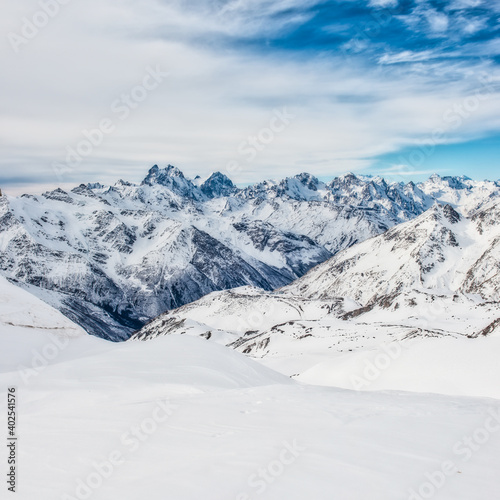 Snow blue mountains in clouds. Winter ski resort © Pavlo Vakhrushev