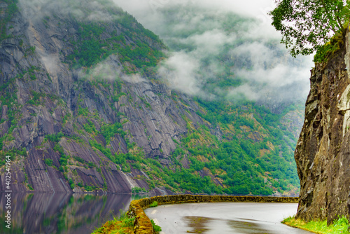 Old road along fjord Eidfjorden, Norway photo