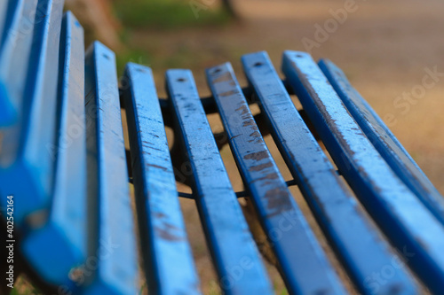 Blue wooden bench in a garden