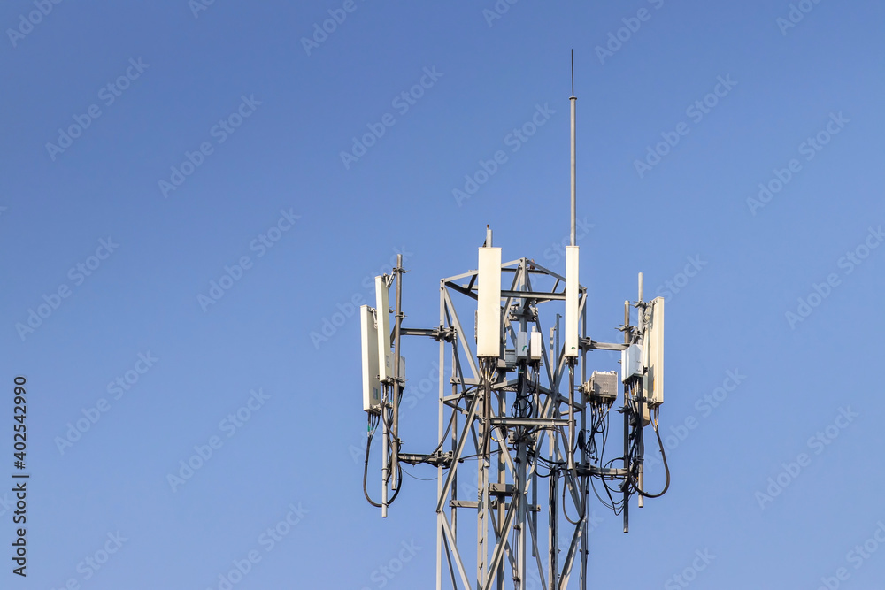 Telecommunication tower with blue sky and white clouds background,satellite pole communication technology.