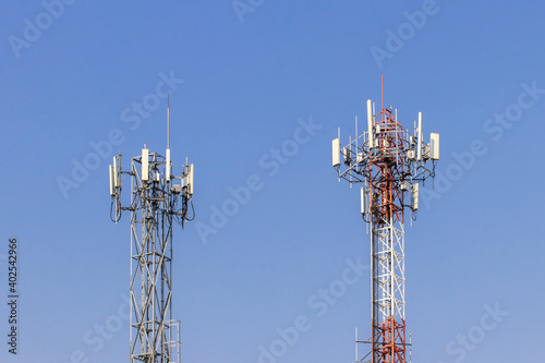 Telecommunication tower with blue sky and white clouds background,satellite pole communication technology.
