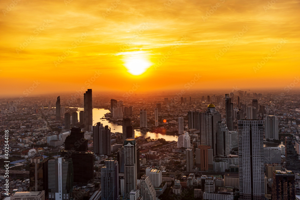 Golden Sunset Bangkok city of cityscape skyline with skyscraper building background in Central business district Bangkok, Thailand