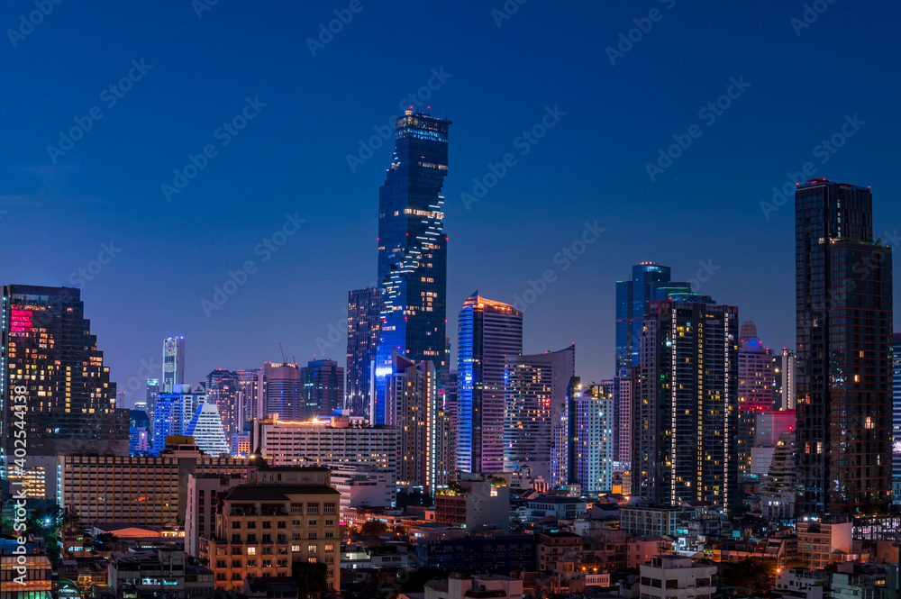 cityscape of Bangkok city skyline with night light skyscraper building background in Central business district Bangkok, Thailand
