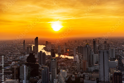 Golden Sunset Bangkok city of cityscape skyline with skyscraper building background in Central business district Bangkok, Thailand