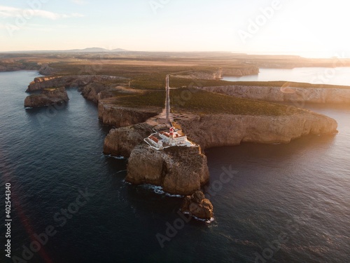 Aerial sunrise panorama of Cabo de Sao Vicente Cape St Vincent mediterranean Algarve cliff atlantic coast beach Sagres