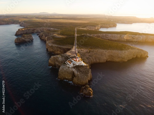 Aerial sunrise panorama of Cabo de Sao Vicente Cape St Vincent mediterranean Algarve cliff atlantic coast beach Sagres