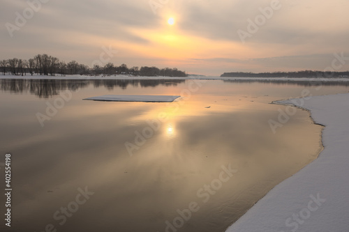 sunset over the river in the early spring