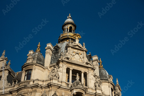 Baroque facade of a historical building on the famous shopping street Meir in Antwerp, Belgium