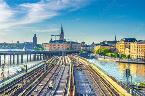 Cityscape of Stockholm historical city centre with Riddarholmen island Church spires  City Hall Stadshuset tower  bridge over Lake Malaren in Gamla Stan and railway subway tracks  Sweden