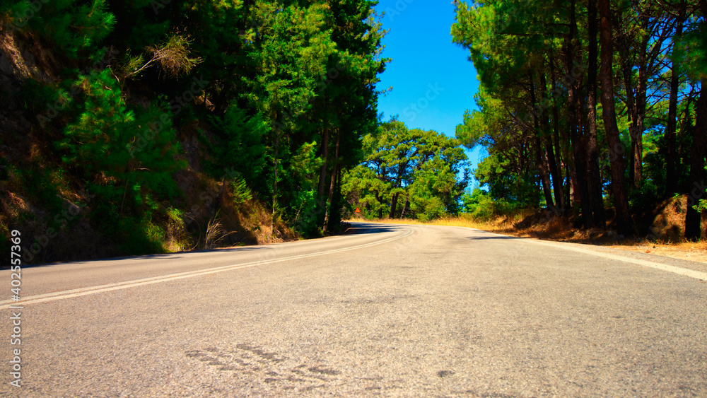 A lonely road in the forest on the island of Rhodes