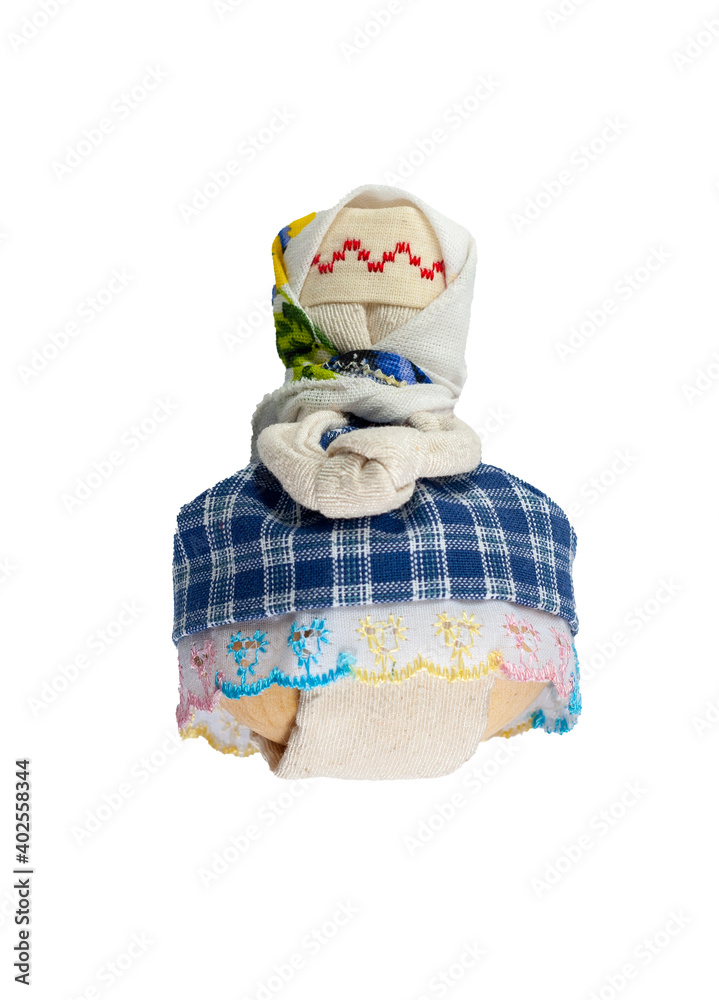 Obraz premium Traditional Russian doll made of fabric. A doll in a blue dress. Home crafts.