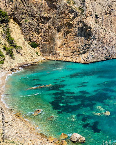 rocks and blue sea views at the Racó del Corb beach, Altea, Alicante, Spain