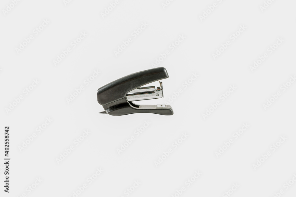 Black stapler. Little. Isolate. Side view Black stapler. Little. Isolate. Side view