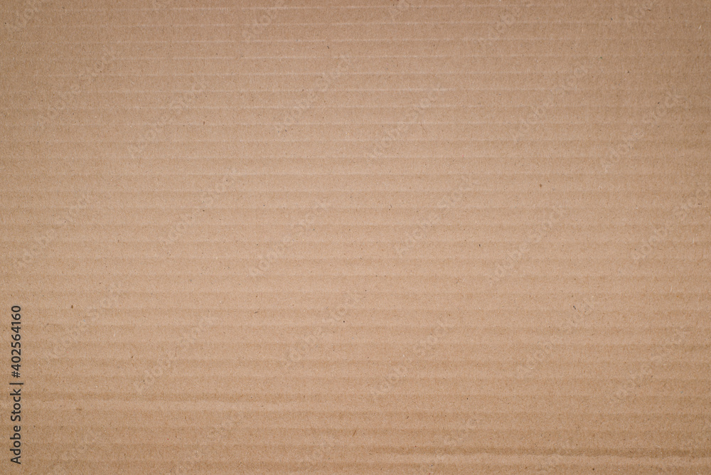 Textured yellow cardboard background, soft vignette. Rough backdrop for design Textured yellow cardboard background, soft vignette. Rough backdrop for design
