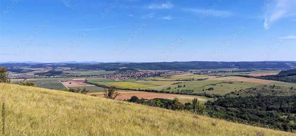 Hungarian countryside landscape with typical village in the background