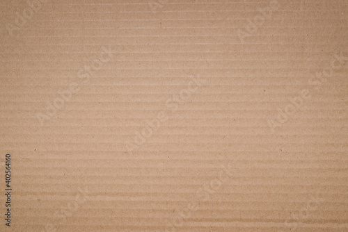 Textured yellow cardboard background, soft vignette. Rough backdrop for design