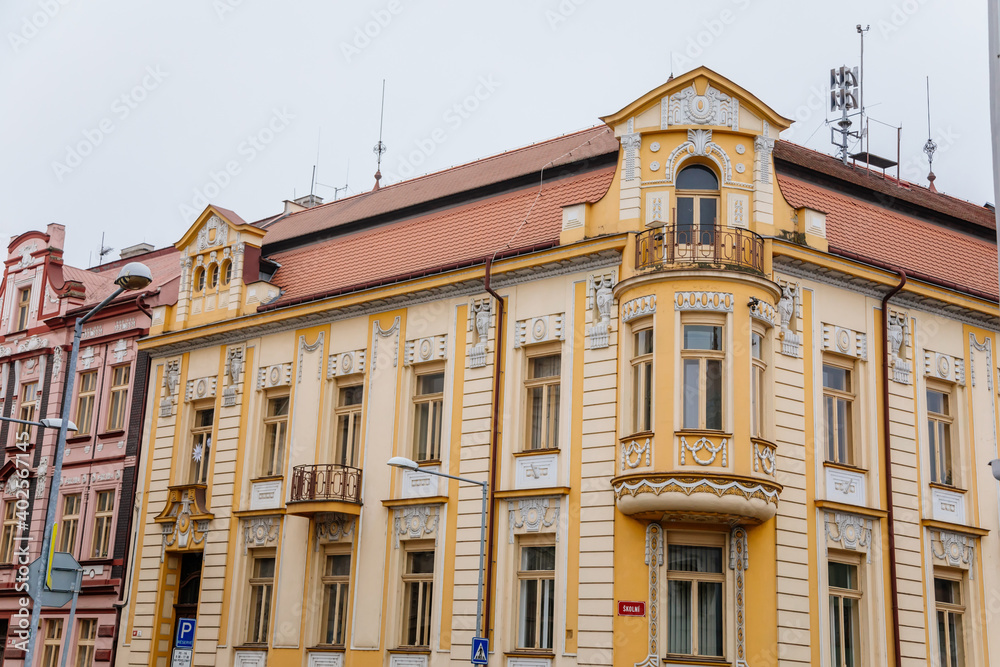 Yellow neo-renaissance house at Wenceslas square in winter day, Narrow picturesque street with historical buildings, Lovosice, Czech Republic Yellow neo-renaissance house at Wenceslas square in winter day, Narrow picturesque street with historical buildings, Lovosice, Czech Republic